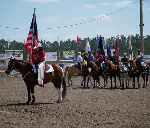Pro Rodeo Contestant Holding Flag